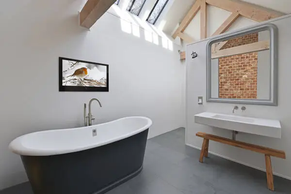 tv wall mounted in a bathroom