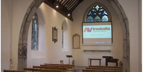 projector screen and projector installation in a traditional church 