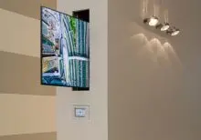 tv sliding out of a wall hidden using the lsm-hz horizontal tv lift