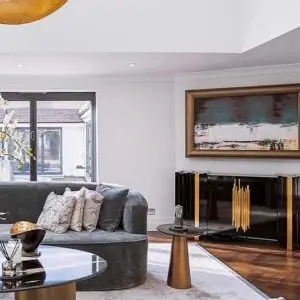 Framed artwork that rolls away to reveal a hidden TV behind