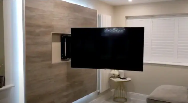 motorised tv wall mount on floating tv media wall