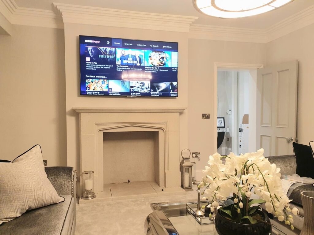 tv mounted on a wall using a professional tv installation service 