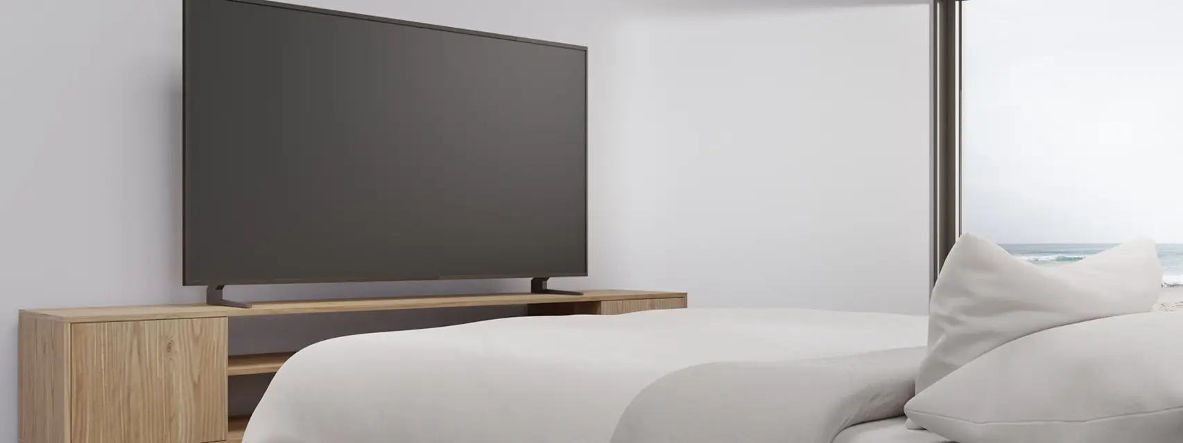 large TV on a cabinet in a bedroom